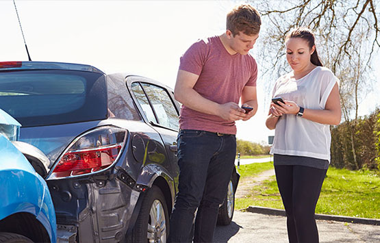 Man and woman exchanging info following an auto collision in San Ramon