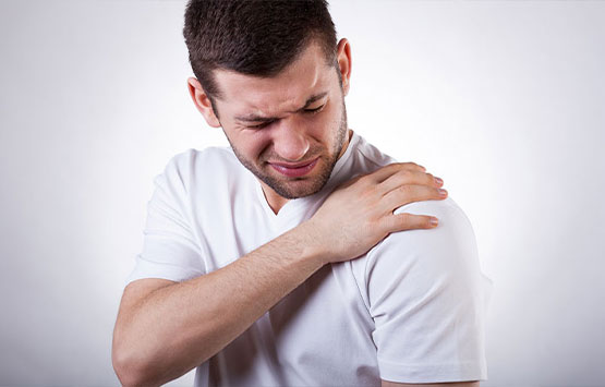 Man suffering with frozen shoulder in need of a chiropractic adjustment at San Ramon Auto Accident Injury Clinic in San Ramon