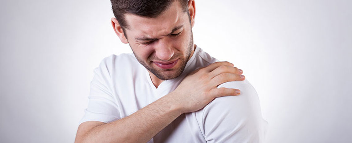 Man suffering with frozen shoulder in need of a chiropractic adjustment at San Ramon Auto Accident Injury Clinic in San Ramon