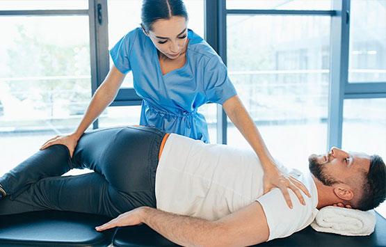 Male patient receiving chiropractic treatment for sciatica at San Ramon Auto Accident Injury Clinic in San Ramon