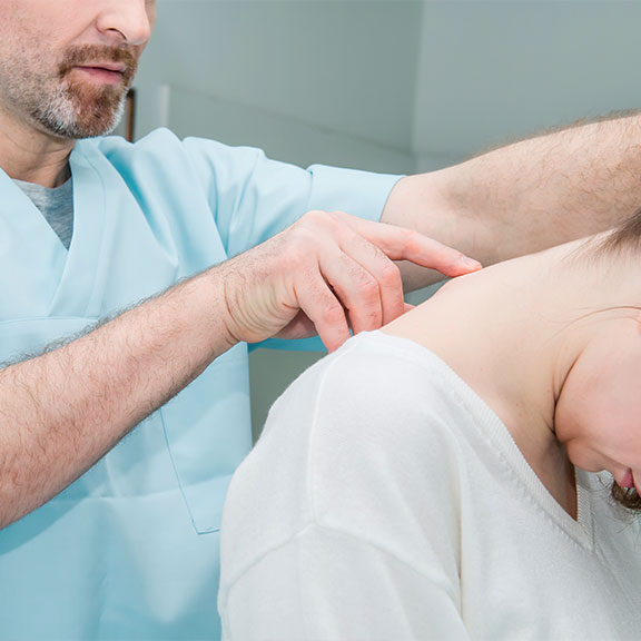 Patient receiving chiropractic consultation for whiplash at San Ramon Auto Accident Injury Clinic in San Ramon