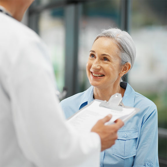 Chiropractor at San Ramon Auto Accident Injury Clinic in San Ramon reviewing patient's medical history